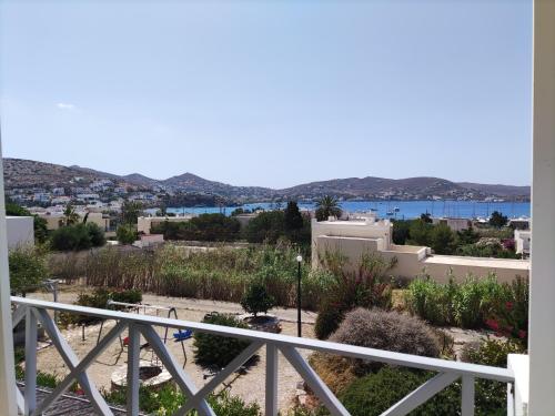 a view of the water from the balcony of a house at Galini Rooms & Apartments in Finikas
