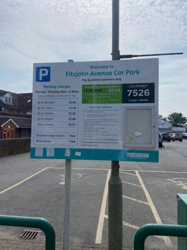 a parking sign in a parking lot at High Barnet Studio Flat in Barnet