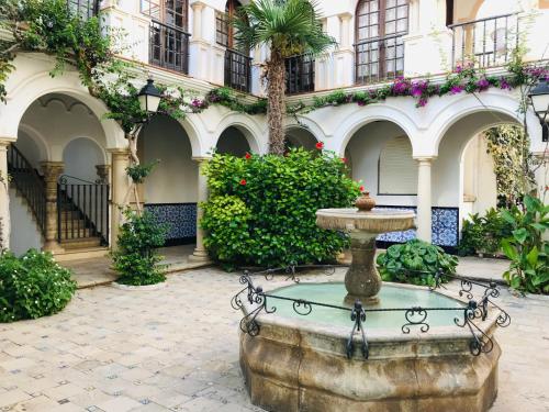 a fountain in the courtyard of a building at Beach house with private swimming pool * 5 min walk to the beach in El Vendrell