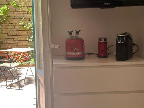 a shelf with two toasters and a toaster on it at Ale e Nino in Chieti