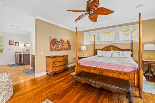 a bedroom with a bed and a dresser at 1730 Kaleka 4 Bed Poipu House, Guest House walk to Beach in Koloa
