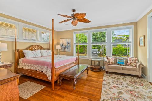 a bedroom with a bed and a ceiling fan at 1730 Kaleka 4 Bed Poipu House, Guest House walk to Beach in Koloa