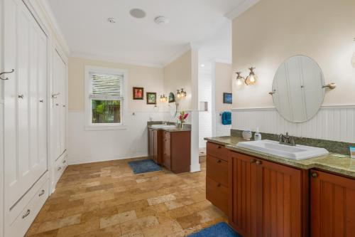 a bathroom with a sink and a mirror at 1730 Kaleka 4 Bed Poipu House, Guest House walk to Beach in Koloa