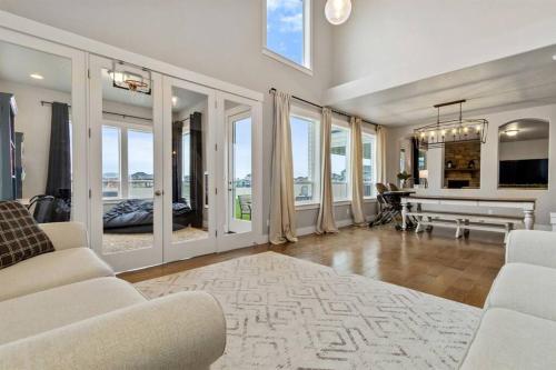 a living room with white furniture and a grand piano at The Dream Home with 5 bedrooms in Meridian ID in Meridian