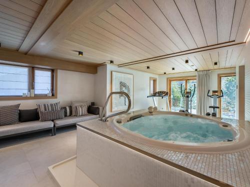 a large bathroom with a large tub in a room at Chalet Méribel, 7 pièces, 12 personnes - FR-1-566-44 in Les Allues