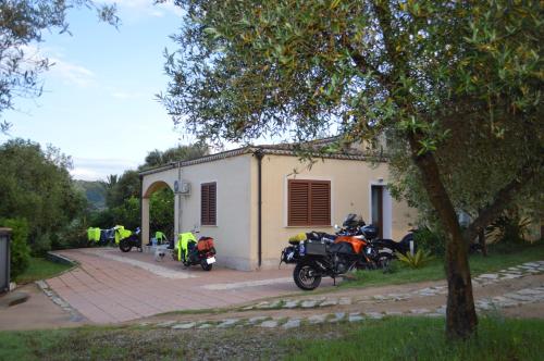 a group of motorcycles parked in front of a building at Casa vacanze da Anna in Tortolì