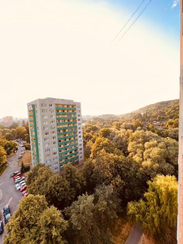 an overhead view of a tall building with trees at Sparrow apartmens 3 in Košice