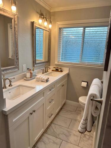 a bathroom with a sink and a toilet at Secluded Home w/pool 5 minutes from American River in Carmichael