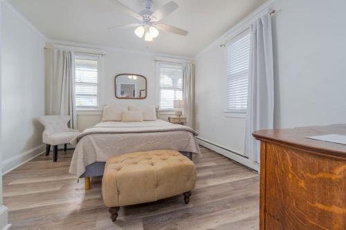 a bedroom with a bed and a ceiling fan at The Stockton - Victorian Ocean Grove near Asbury in Ocean Grove