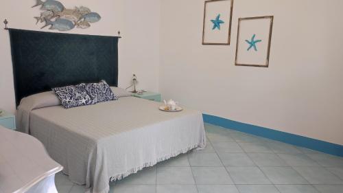 Postel nebo postele na pokoji v ubytování Sanacore - Maratea - Cersuta
