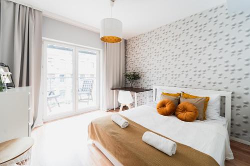 a bedroom with a bed with two pumpkins on it at New Apartment OLD TOWN - 3 Rooms - 7 People - Parking Place - Kościuszki Street in Wrocław