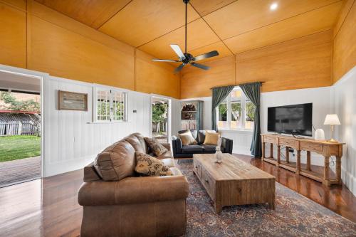 a living room with a couch and a coffee table at The Bank House Ulmarra in Ulmarra