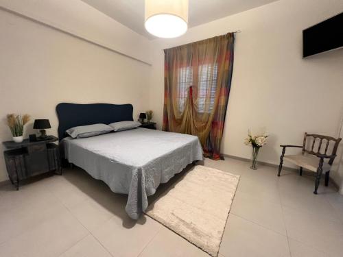 a bedroom with a bed and a window and a tv at B&B Giulianova in Giulianova