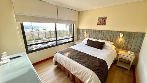 Ένα ή περισσότερα κρεβάτια σε δωμάτιο στο Hotel Canto del Mar