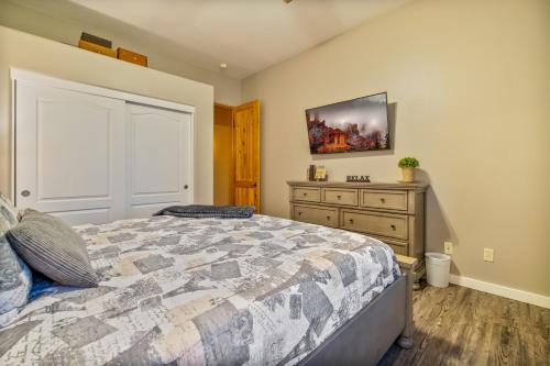 a bedroom with a large bed and a dresser at Quail Mountain Desert Resort: Heated Pool, Mt Vews, all BR's King & TV's, Hiking in Mesa