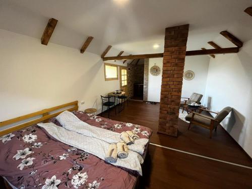 a bedroom with a bed with teddy bears on it at Fruskogorski mir in Besenovacki Prnjavor