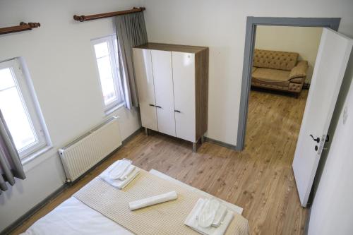 a living room with a table and a mirror at Taksim Neo Pera Suites in Istanbul