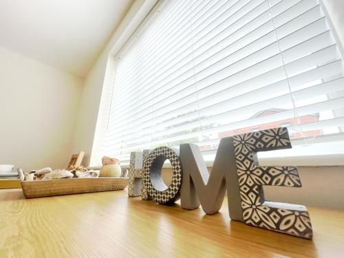 a room with a large window with the word love at Tree View Apartment in Chesterton