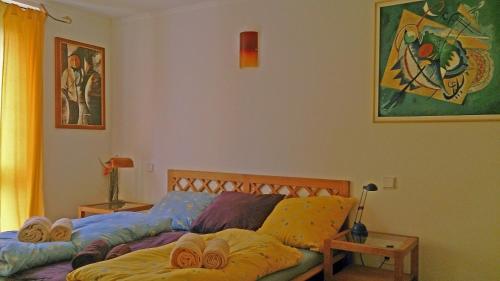 a bedroom with a bed with pillows on it at Deluxe Apartment in Überlingen