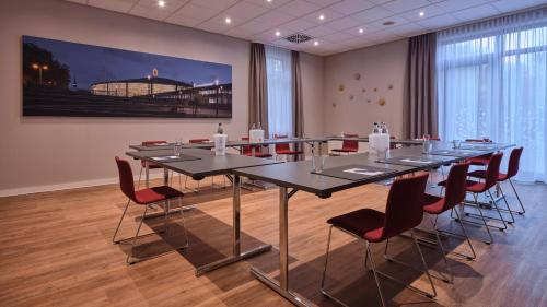 a conference room with a long table and chairs at Holiday Inn Express Dortmund by IHG in Dortmund
