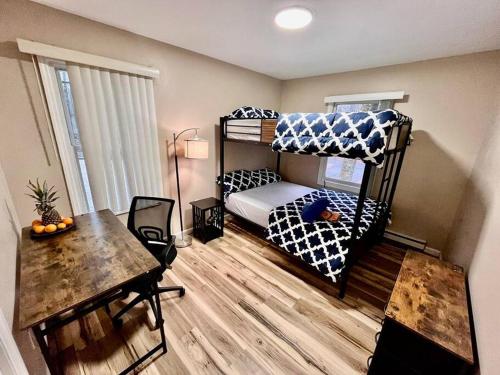 a small room with a bunk bed and a table at Sauna, Games,Grill, View,Lake,Pool,TVs in Albrightsville