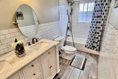 a bathroom with a sink and a toilet and a mirror at Sauna, Games,Grill, View,Lake,Pool,TVs in Albrightsville