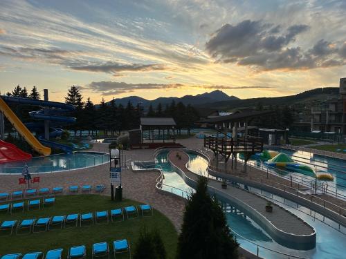 a view of a water park with two pools at Apartmán Bešeňová 289 in Bešeňová