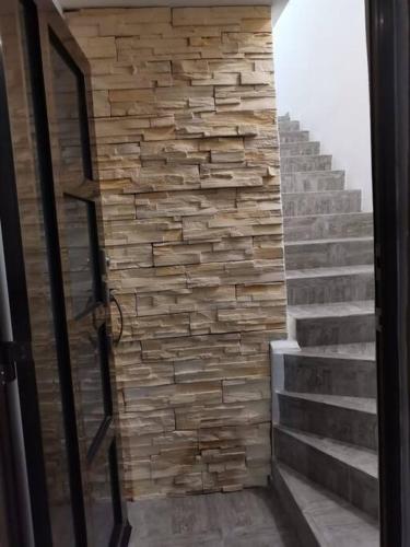 a stone wall next to a set of stairs at Gran Plaza, Cancún in Cancún