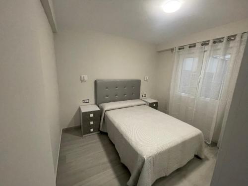 Llit o llits en una habitació de Apartamento de lujo en Cullera con Aire Acondicionado y posibilidad de Parking
