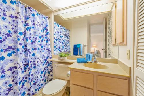 a bathroom with a toilet and a sink and a shower at Beautiful Princeville Garden Condo with lots of Amenities C2108 in Princeville