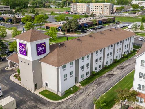 an overhead view of a building with a purple sign on it at Sleep Inn Naperville - Chicago in Naperville