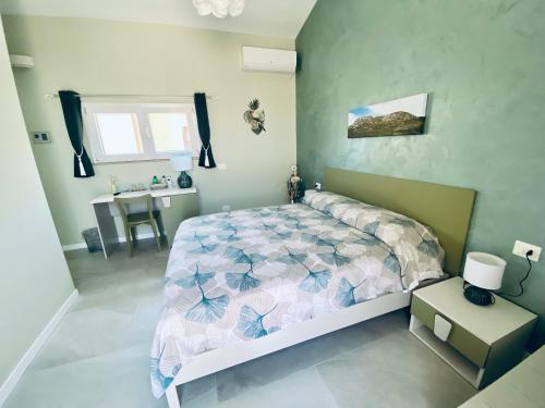Cama o camas de una habitación en B&B L'EDEN DI CAPO BIANCO