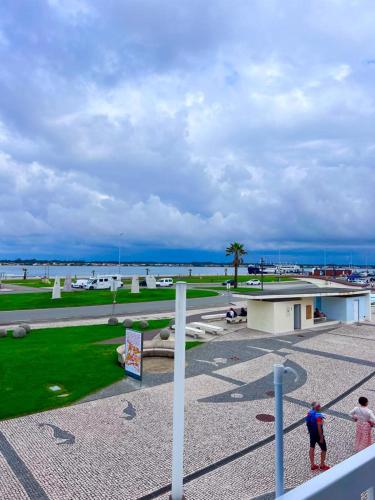 a group of people standing in a park at Palheiro da Ana in Costa Nova