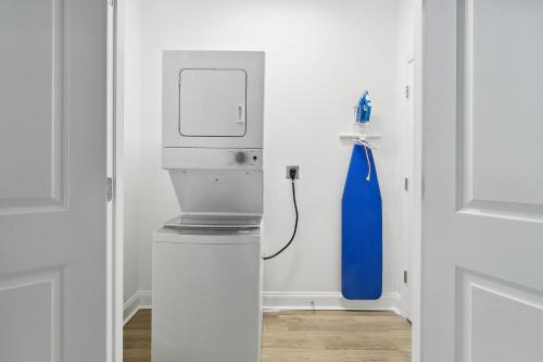 a white room with a blue water gun on the wall at New Luxury 3BR w Jacuzzi in New Orleans