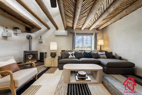 a living room with a couch and a table at Rancho de La Luna Casita in Santa Fe