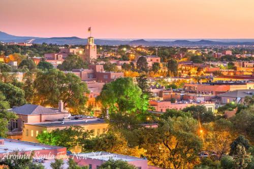 a view of a city at night at Rancho de La Luna Casita in Santa Fe