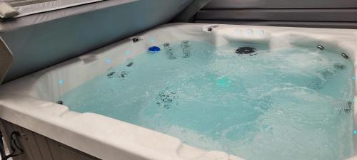 a bath tub filled with blue water in at Lakeside hotel room #8 in Kings Beach in Kings Beach