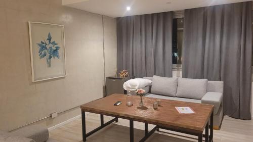 a living room with a couch and a table at La Belle San Isidro Lofts in San Isidro