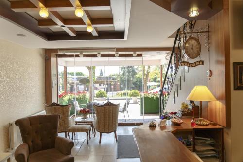 a dining room with a table and chairs and a large window at Hotel Ipekyolu in Istanbul