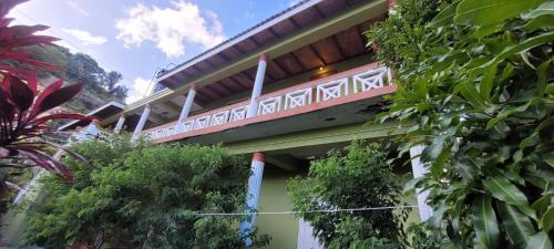 a building with a train on top of it at Casa Villa Apartments in Calliaqua
