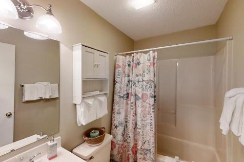 a bathroom with a shower and a toilet and a sink at Fairway Village Paradise in Myrtle Beach