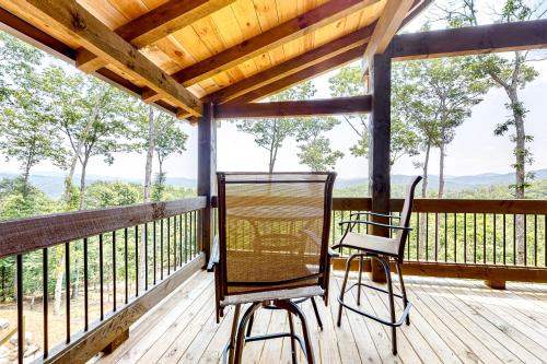 a porch with two chairs and a wooden roof at Liberty Call in Blue Ridge