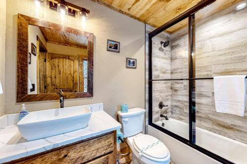 a bathroom with a sink and a tub and a toilet at Liberty Call in Blue Ridge