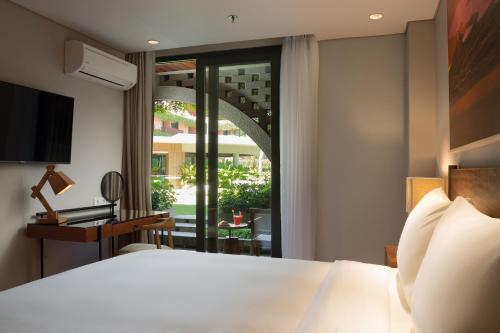 Cama o camas de una habitación en Beachwalk Residence