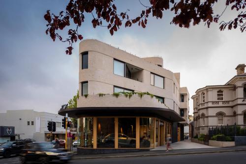 a building on the corner of a city street at The Rox Hobart in Hobart
