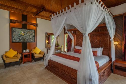 Postel nebo postele na pokoji v ubytování Bali Tropic Resort & Spa - CHSE Certified