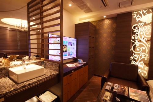 Televisyen dan/atau pusat hiburan di Hotel Lei