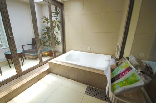 Katil atau katil-katil dalam bilik di Hotel Lei