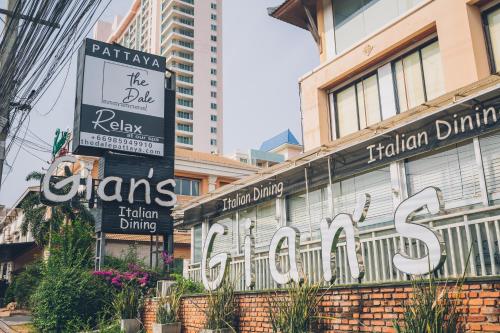 a sign for a restaurant on the side of a building at Chateau Dale Boutique Resort Spa Villas in Pattaya South
