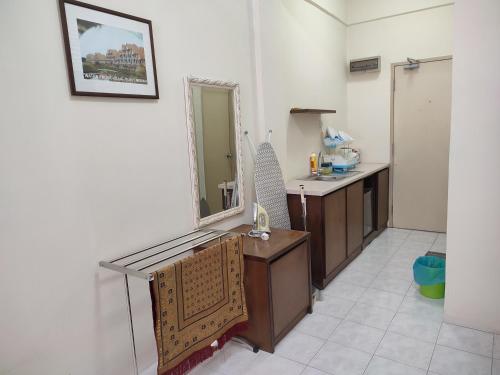 a bathroom with a sink and a mirror at Sofea Inn Bukit Merah - Laketown D6529 in Kampong Selemat